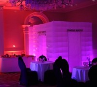 Our enclosed photobooth lights up eight different colors and is 8'X8'.