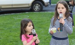 Kids doing a great job singing their favorite songs outside for a Memorial Day party,