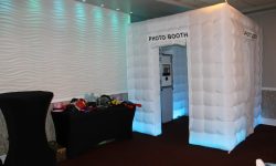 Our elegant enclosed photobooth with our props table with fun and unique party props for guests to utilize.