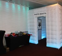 Our elegant enclosed photobooth with our props table with fun and unique party props for guests to utilize.